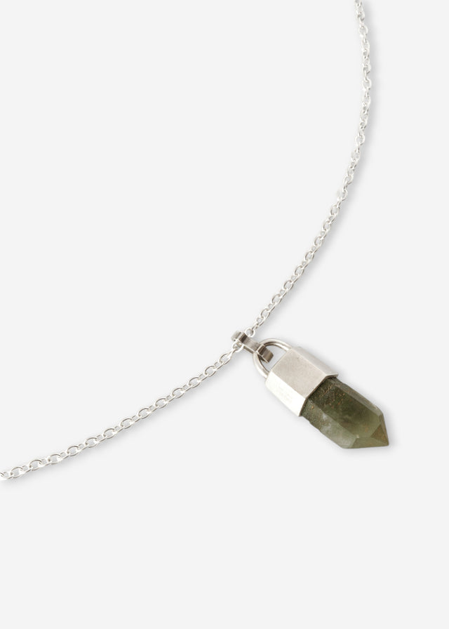 Silver cable chain necklace, faceted olive-green stone point in a polished silver cap, white studio background — STRUGA